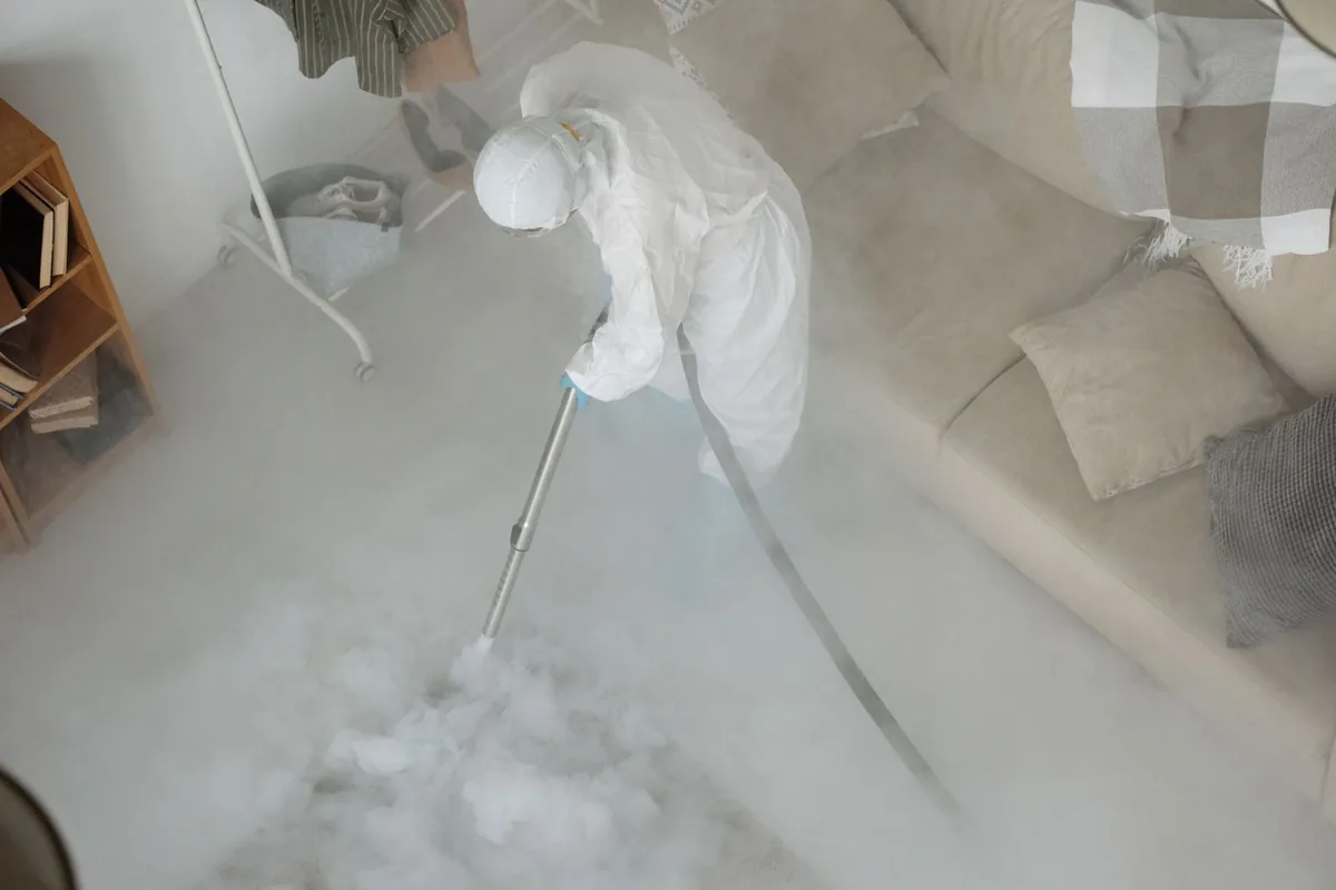 Biohazard cleanup technician in protective equipment, Piedmont, MO